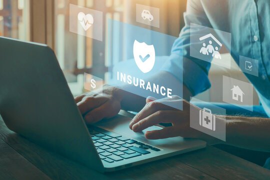 Insurance professional using CRM technology on laptop